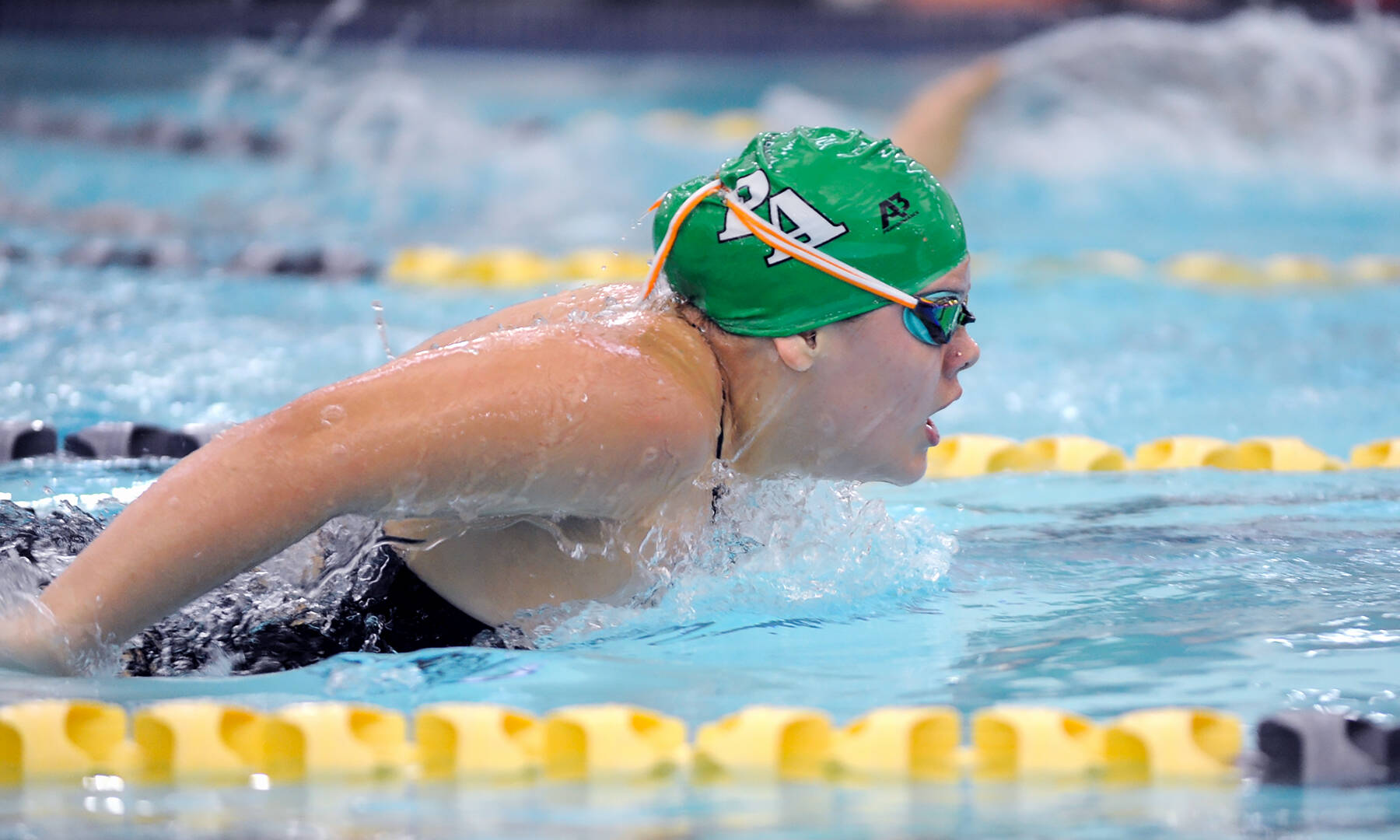 Port Angeles’ Amayah Nelson earned a new personal best-time while swimming to a second-place finish in the 100-yard butterfly during an Olympic League swim meet with Sequim on Wednesday at the YMCA of Sequim.