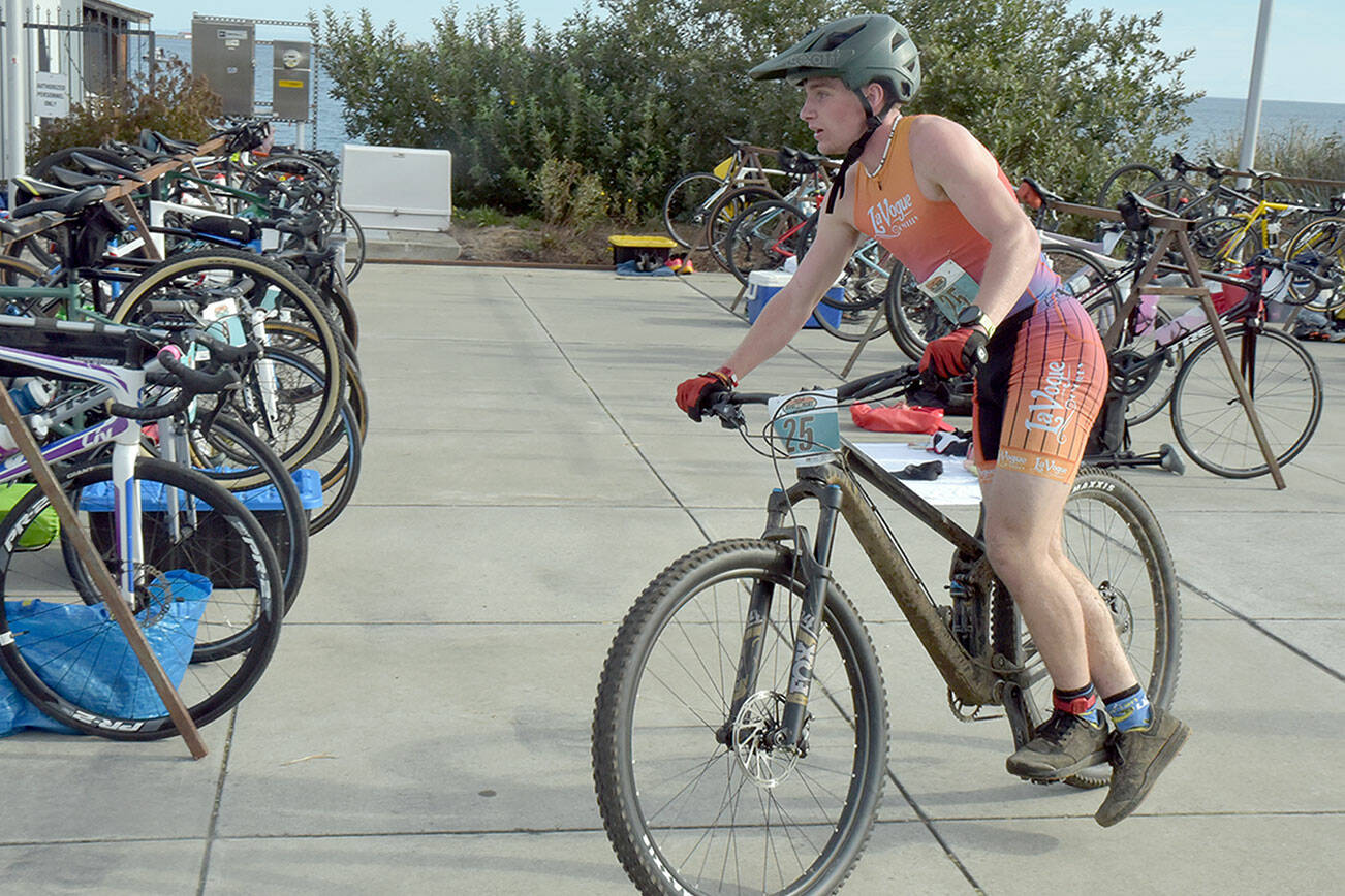 Henry Nelson finishes the mountain bike stage in second place at Saturday’s Big Hurt at Pebble Beach in Port Angeles. Nelson finished third overall in the ironman category. (Keith Thorpe/Peninsula Daily News)