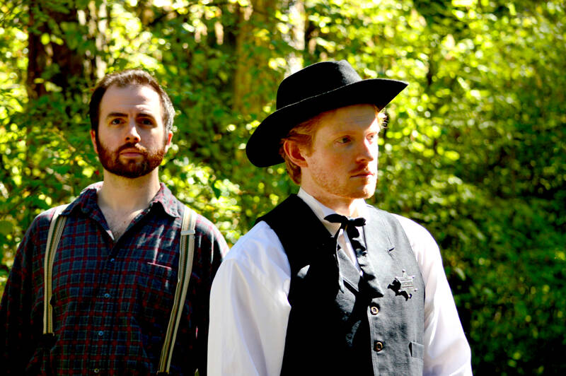 Casey Raiha, left, portrays the titular fugitive while Ricky Spauldng is Sheriff Giles Quimby in “Wild Man of the Wynoochee” at Key City Public Theatre in Port Townsend. (Diane Urbani de la Paz)