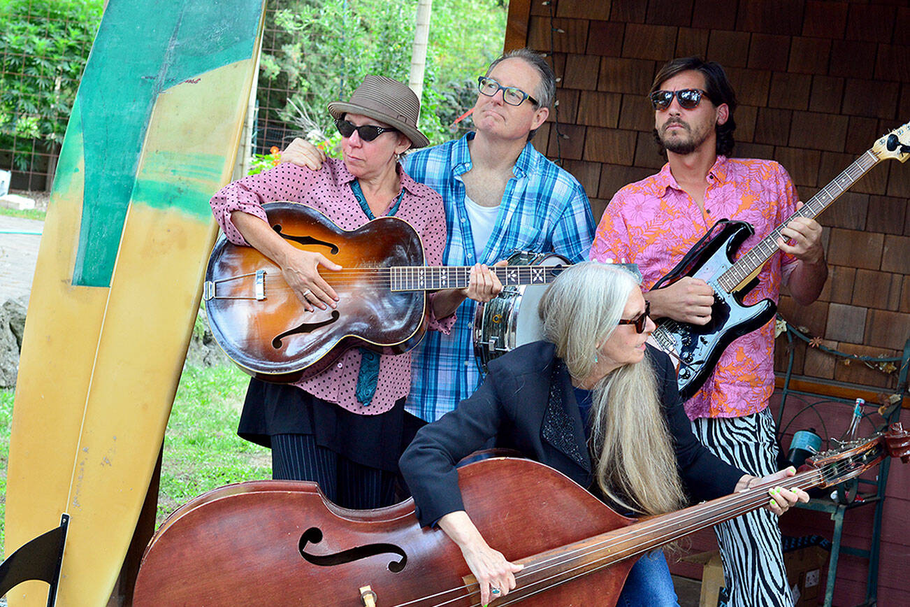 The Salish Surf Rockabillies will play the Oct. 19 Northwind Art Gala at Fort Worden’s USO Hall. From left are singer-guitarist Jessica Logan, drummer Dana Sullivan, upright bassist Tracy Grisman and guitarist-vocalist Chile Dog Quiroz. (Diane Urbani/Northwind Art)