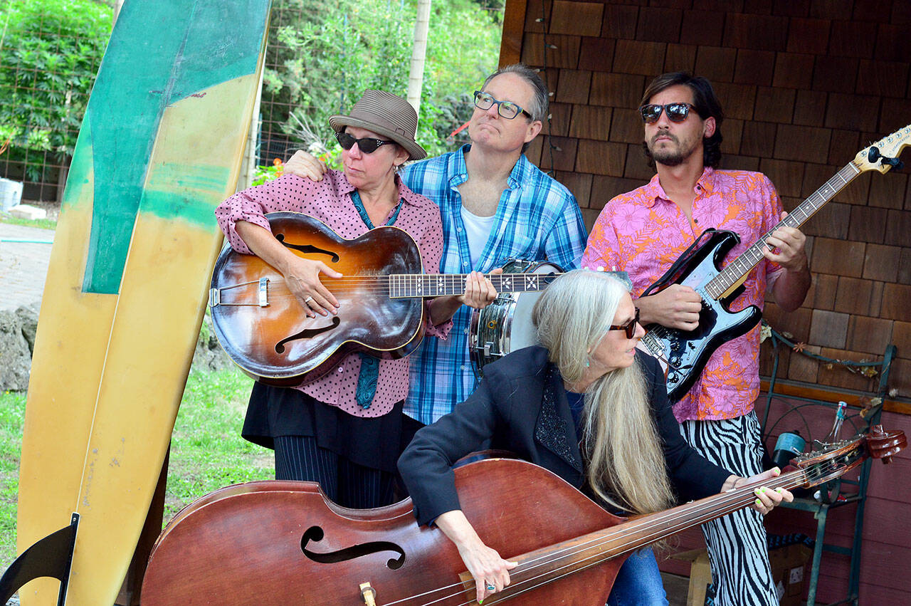 The Salish Surf Rockabillies will play the Oct. 19 Northwind Art Gala at Fort Worden’s USO Hall. From left are singer-guitarist Jessica Logan, drummer Dana Sullivan, upright bassist Tracy Grisman and guitarist-vocalist Chile Dog Quiroz. (Diane Urbani/Northwind Art)