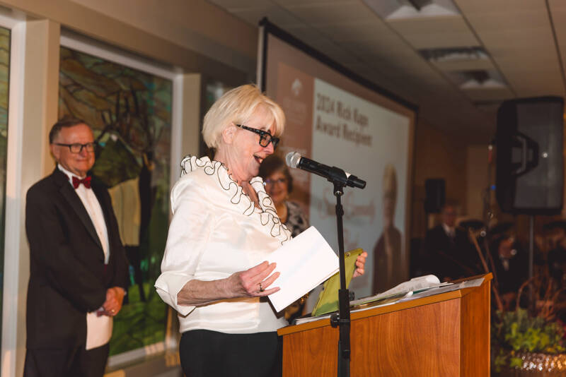 Laurie Stewart, CEO of Sound Community Bank, accepts the Rick Kaps award at the annual Harvest of Hope gala at the Guy Cole Event Center in Sequim.