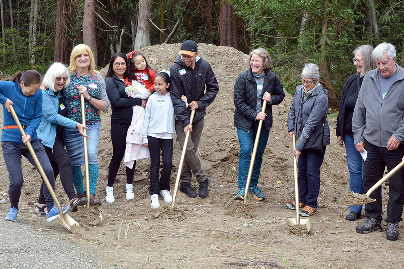 Partner families break ground along with supporters on Tuesday in Port Townsend. (Elijah Sussman/Peninsula Daily News)