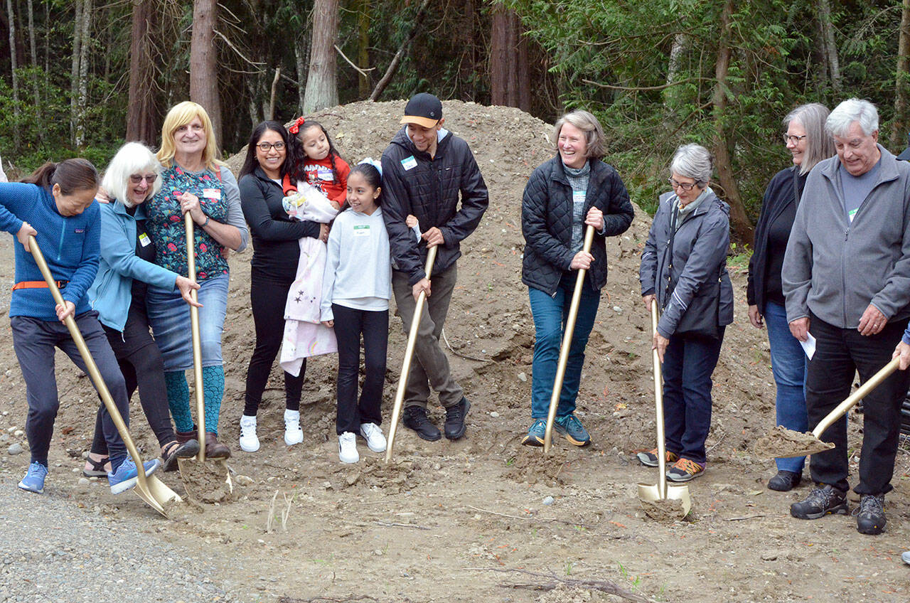 Partner families break ground along with supporters on Tuesday in Port Townsend. (Elijah Sussman/Peninsula Daily News)