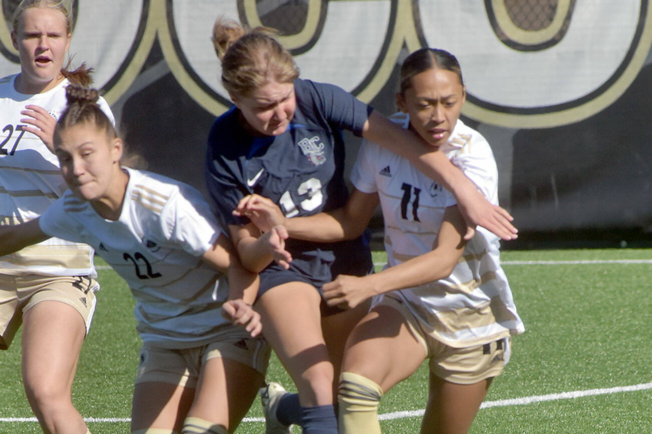 KEITH THORPE/PENINSULA DAILY NEWS
In a scramble for a loose ball, players tangle at midfield, including, from left, Peninsula's Lauren Lases, Page Johnson, Bellevue's Karly Ellis and Peninsula's Jaeda Mae Edayan on Wednesday in Port Angeles.