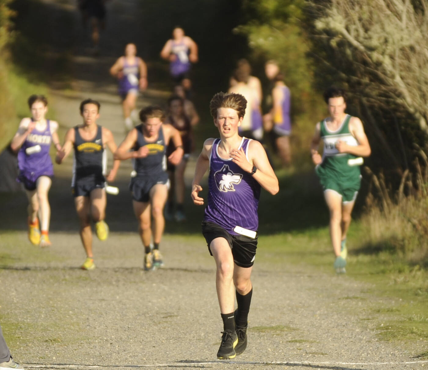 Michael Dashiell/Olympic Peninsula News Group
Sequim’s Adrian Osborne runs ahead of the pack during the Olympic League cross country meet at Voice of America at the Dungeness Recreation Area on Wednesday.