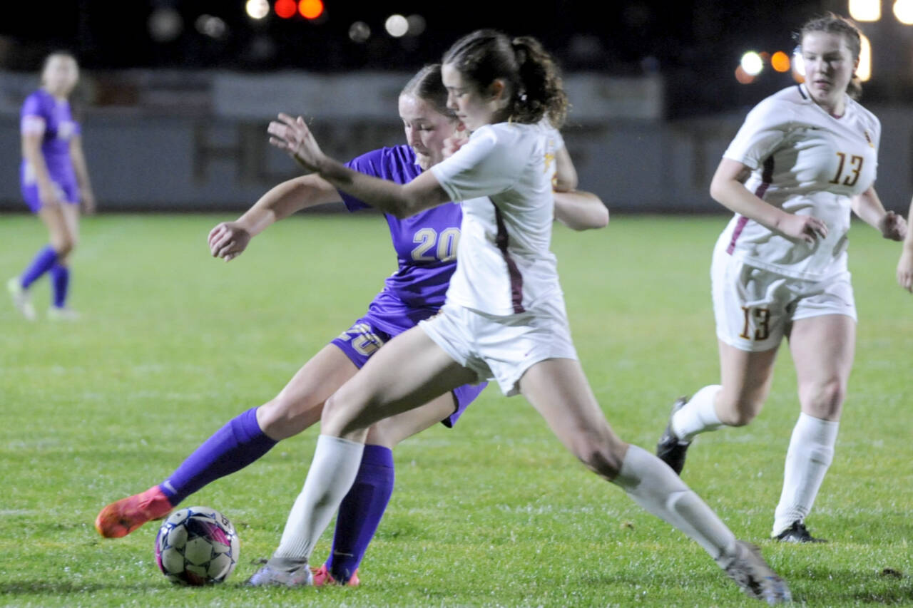 Sequim's Sasha Yada (20) battles for a ball against a Kingston player on Tuesday in Sequim. Kingston won the match 3-2 in penalty kicks. (Michael Dashiell/Olympic Peninsula News Group)