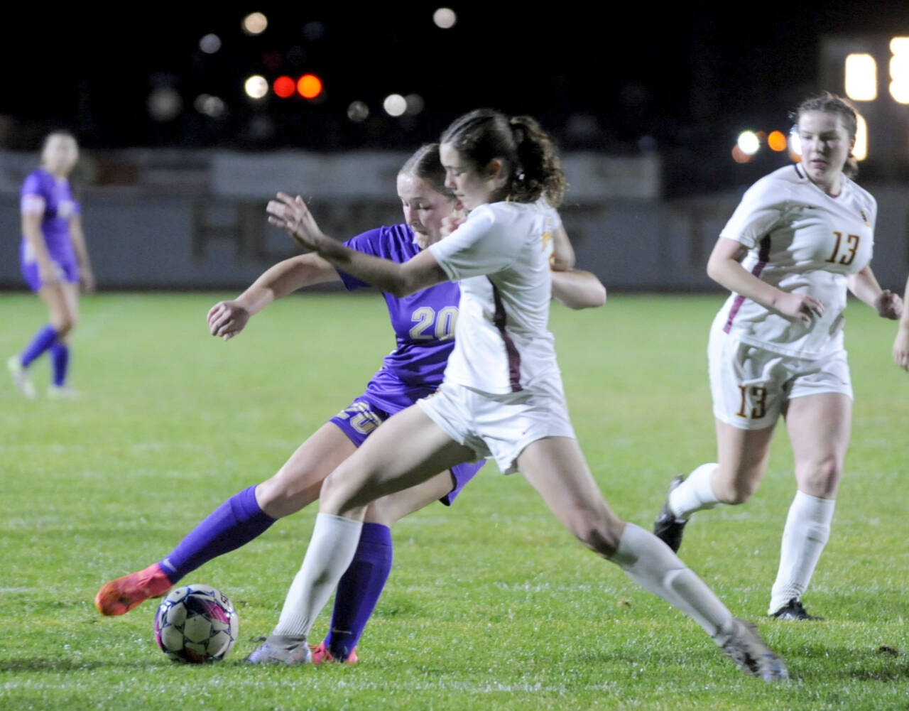 Sequim’s Sasha Yada (20) battles for a ball against a Kingston player on Tuesday in Sequim. Kingston won the match 3-2 in penalty kicks. (Michael Dashiell/Olympic Peninsula News Group)