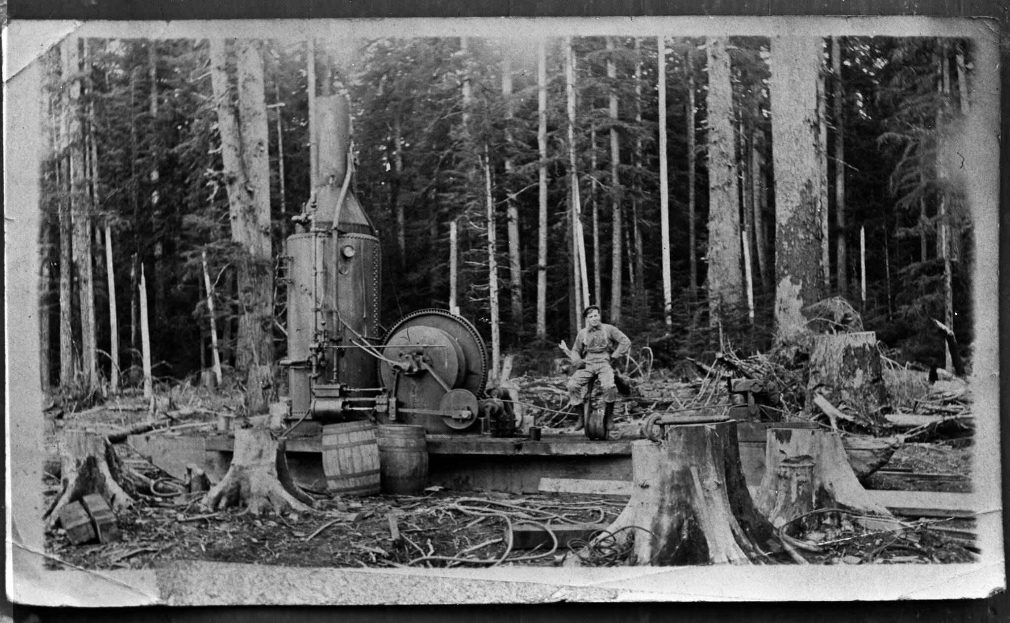 Hickory Shirt Heritage Days celebrates the logging history of the West End. Here an unidentified man is seated on a single-drum donkey engine in Forks during the late 19th to early 20th century. (Bert Kellogg Collection)