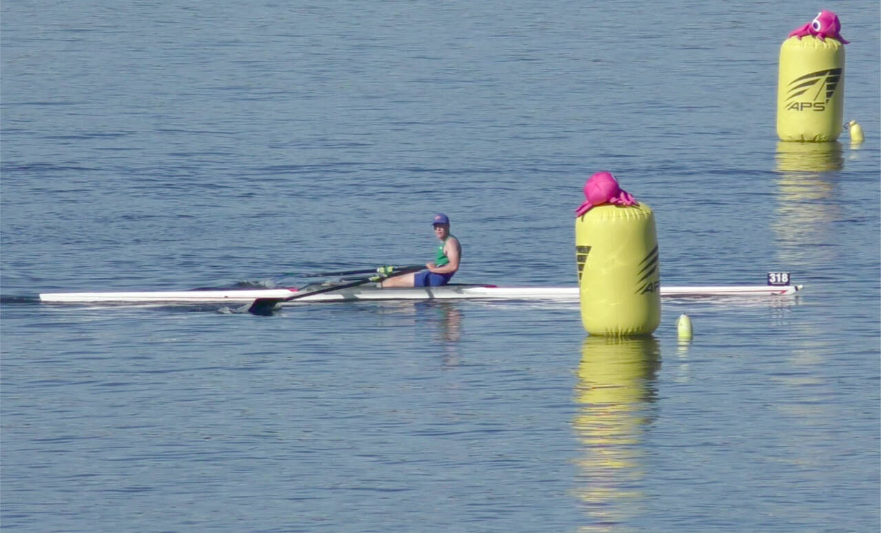 Olympic Peninsula Rowing Association's Cooper Disque crosses the finish line in first place in the U17 1x division in the American Lake Fall Classic in Lakewood on Sunday. (OPRA)