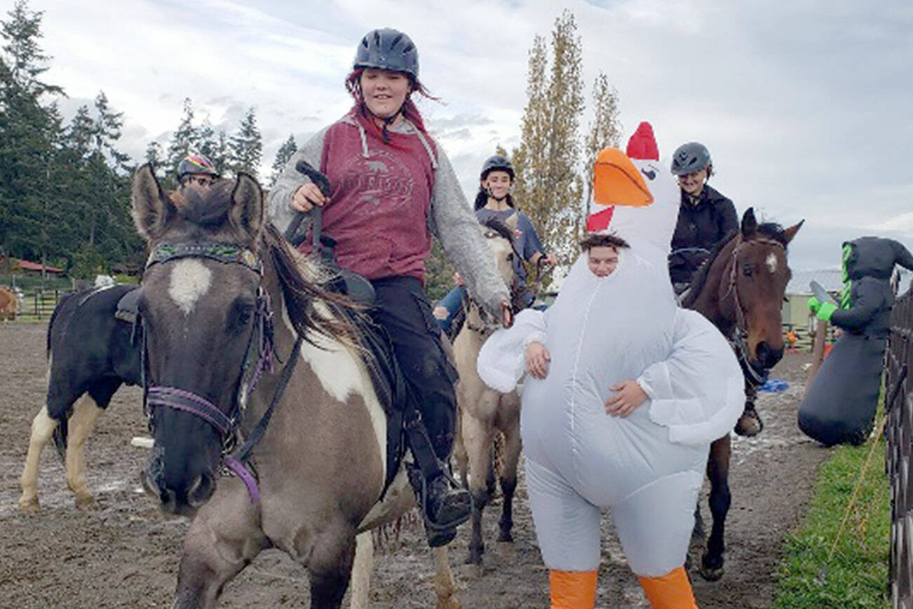 Photo by Emily Bishop

Cutline: Suzanna Bishop’s horse Dru happily walks away after head butting the scary “Giant Chicken Monster” at a fun-filled obstacle course hosted by JeffCo’s 4-H Horse Club.