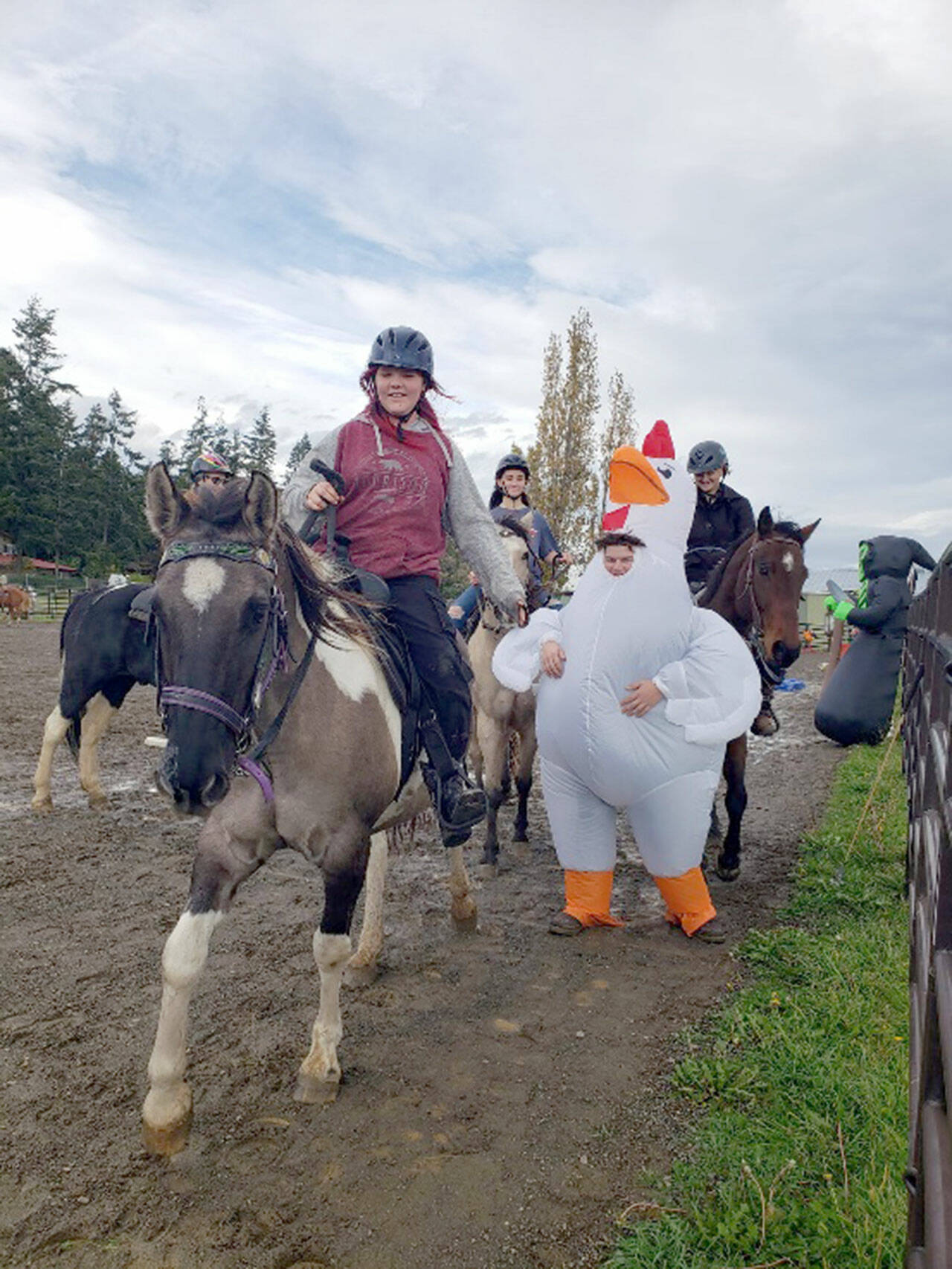 Photo by Emily Bishop
Suzanna Bishop’s horse Dru happily walks away after head butting the scary “Giant Chicken Monster” at a fun-filled obstacle course hosted by JeffCo’s 4-H Horse Club.