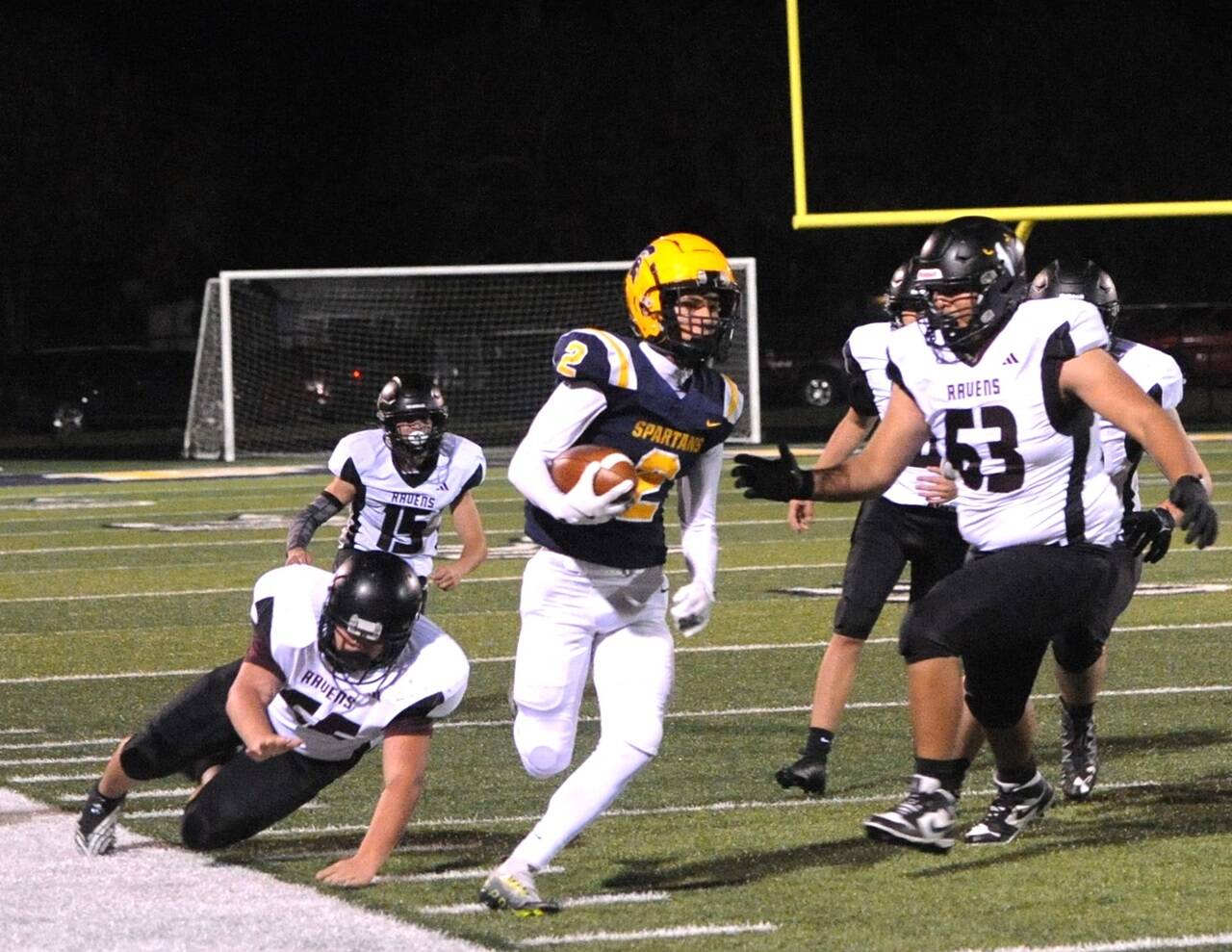 Forks' Neah Foster runs down the sideline against Raymond-South Bend at Spartan Stadium on Friday night. Forks won 35-8. (Lonnie Archibald/for Peninsula Daily News)