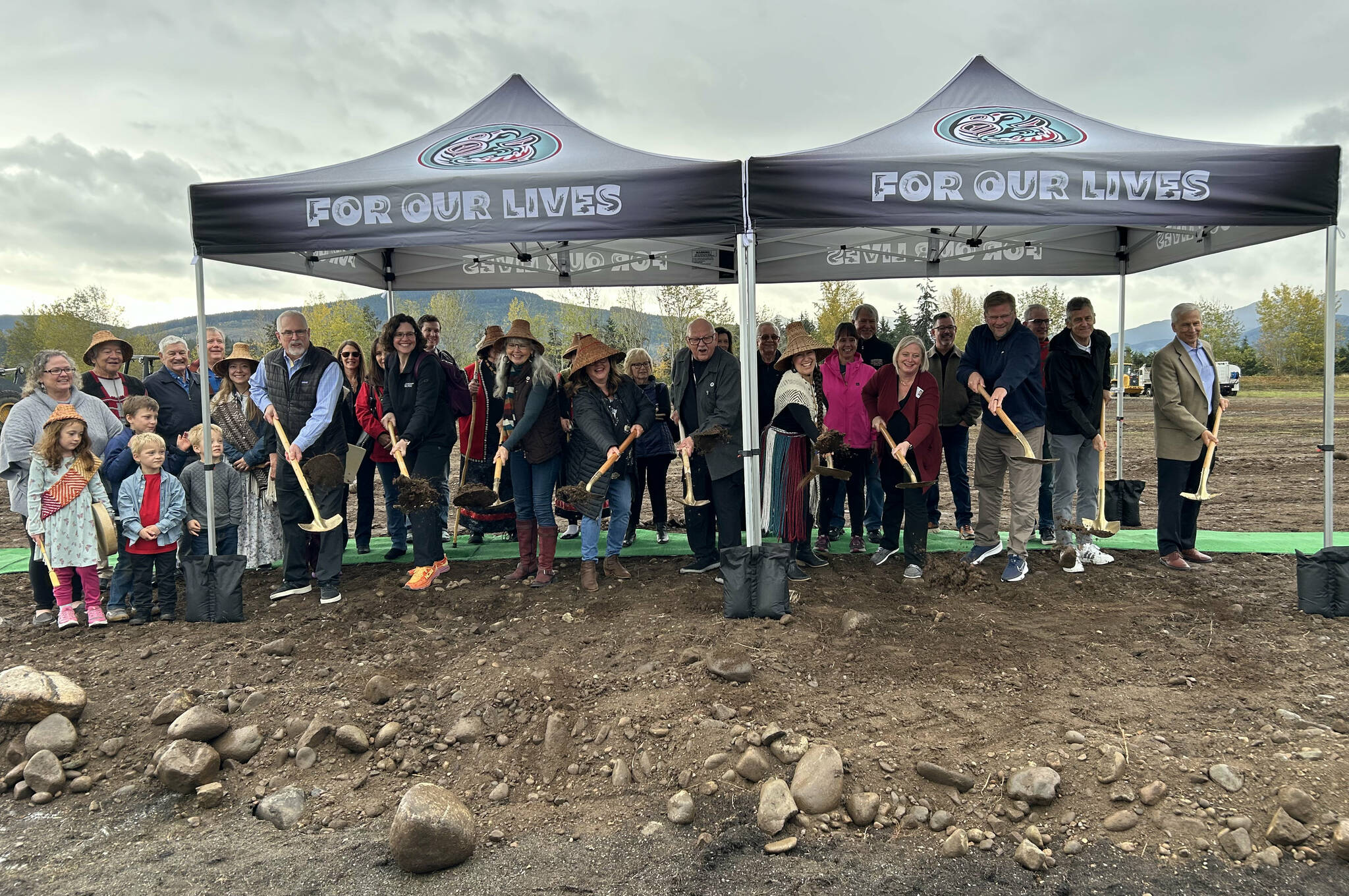 Tribal leaders, health providers and supporters stand for a ceremonial ground breaking on Oct. 19 for The Jamestown Evaluation and Treatment Center, a 20,000-square-foot, 16-bed treatment center for patients experiencing a mental health crisis. (Matthew Nash/Olympic Peninsula News Group)