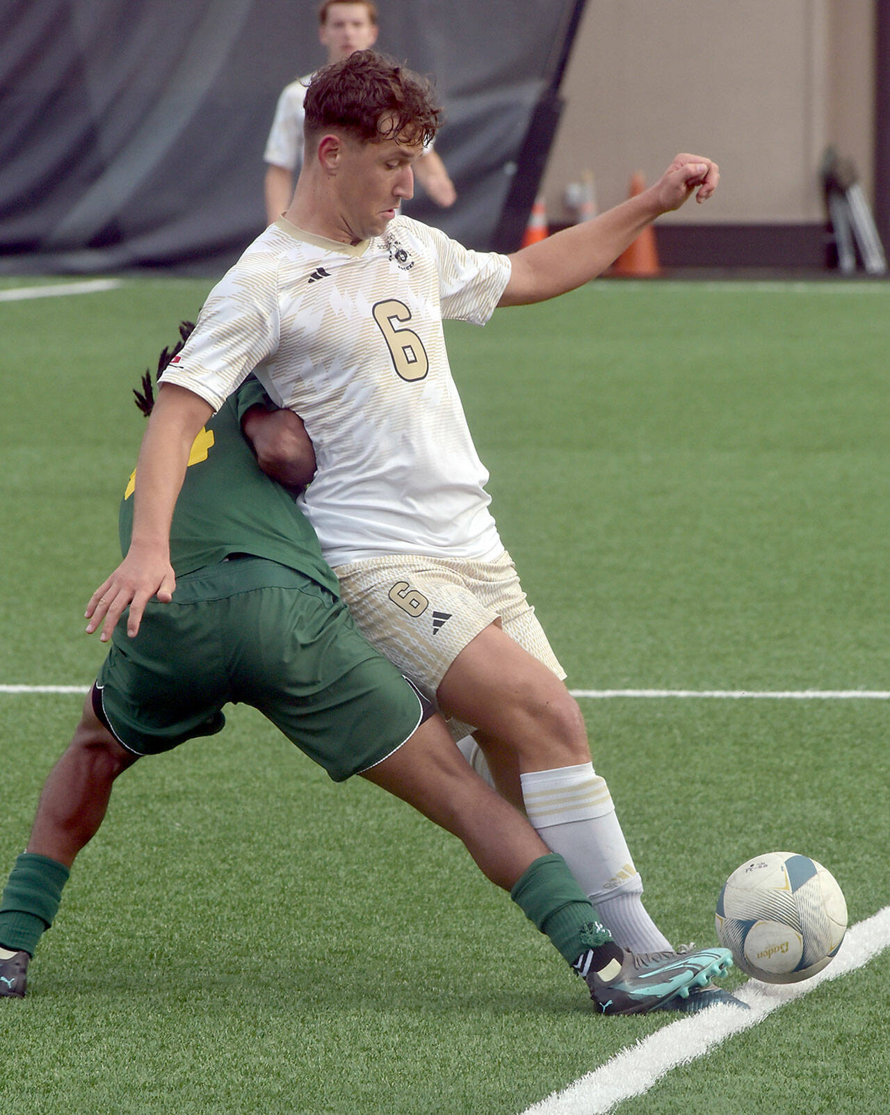 KEITH THORPE/PENINSULA DAILY NEWS
Peninsula's Konrad Muller, front, struggles to keep the ball inbounds as Shoreline's Tesfu Gebrehiwet  makes his own move on Saturday at Peninsula College.