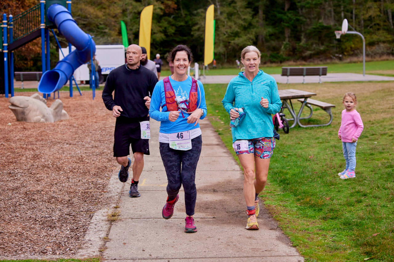 Dan Greer (32) was the individual winner of the Salt Creek 24 at the Salt Creek Recreation Area west of Port Angeles. He went 107.8 total miles. Also running in the race are Jennifer Jones (46) and Samanth Carrel (16). (Matt Sagen/Cascadia Films)