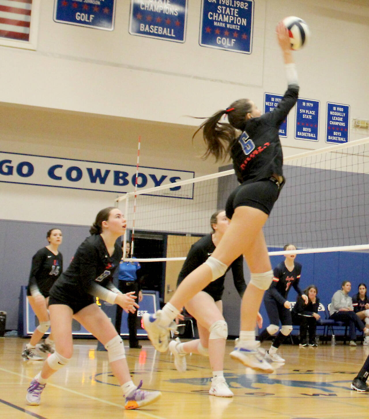 Senior Sophia Petta spikes the ball against Annie Wright on Monday night in Chimacum. It was Petta’s final home match for the Rivals and she responded with 44 digs. (Courtesy of Carrie Beebe)