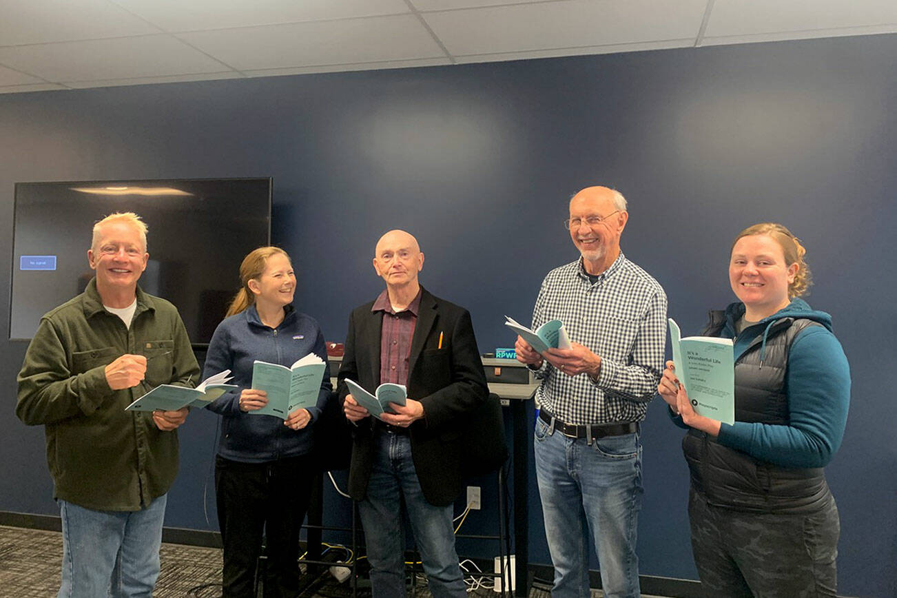 Cast members, from left, Stephen Browning, Christie Lang, Glenn Gilbert, Jim Gormly and Kelly McNees rehearse for the Port Ludlow Players’ production of “”Its a Wonderful Life: A Live Radio Play.”