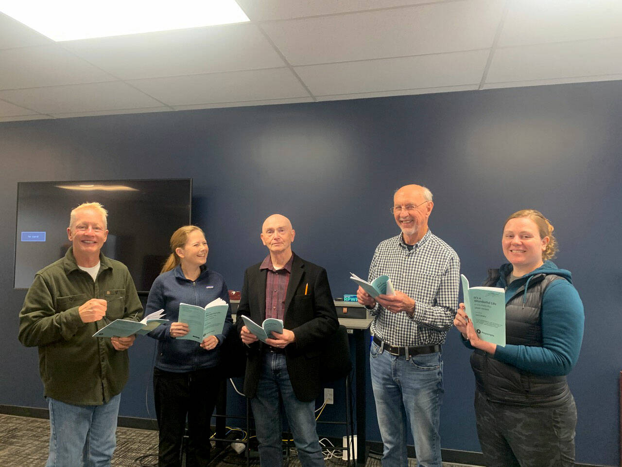 Cast members, from left, Stephen Browning, Christie Lang, Glenn Gilbert, Jim Gormly and Kelly McNees rehearse for the Port Ludlow Players’ production of “”Its a Wonderful Life: A Live Radio Play.”