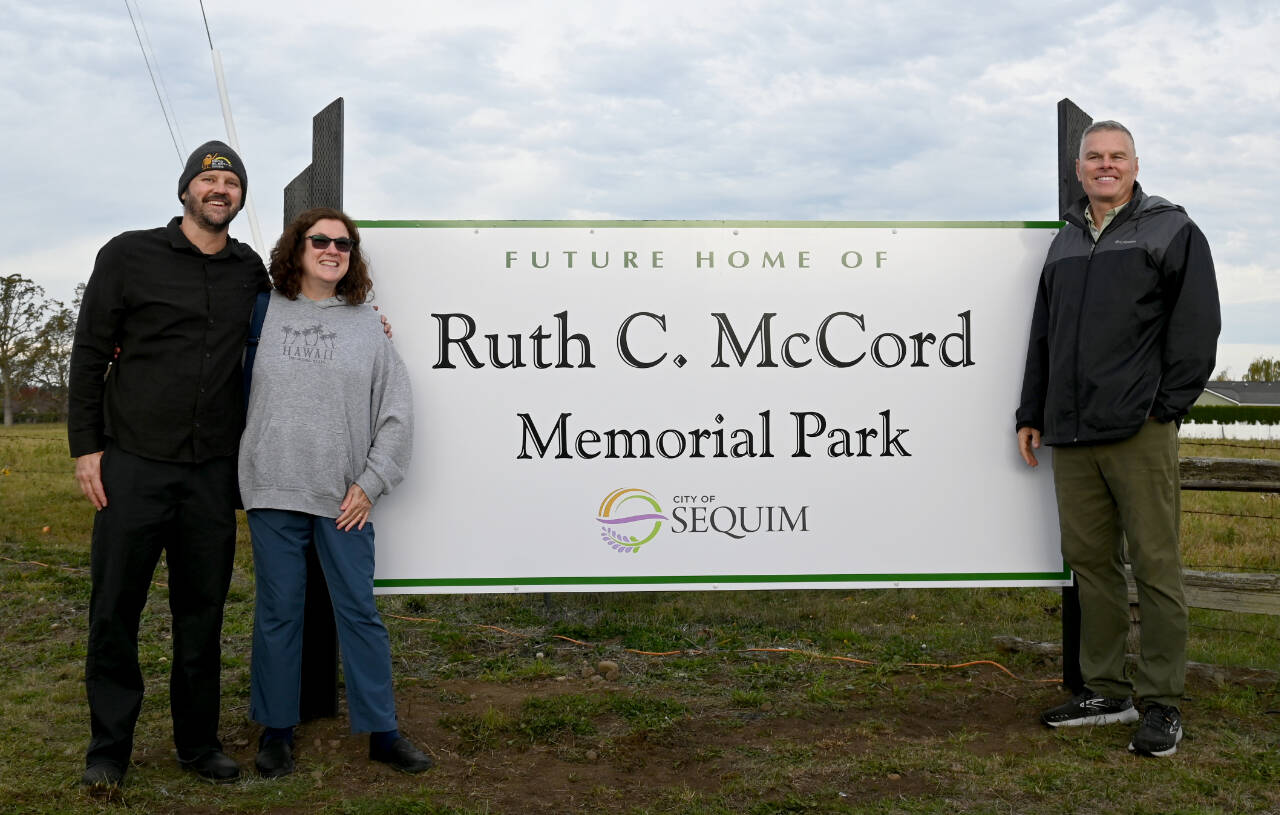 Family members of Ruth McCord celebrate the dedication of a park named after their mother’s legacy on Oct. 25. The future park, located near North Seventh Avenue and West Hendrickson Road, looks to honor the late Sequim resident’s wishes to offer a place for youngsters and the elderly alike. (Michael Dashiell/Olympic Peninsula News Group)