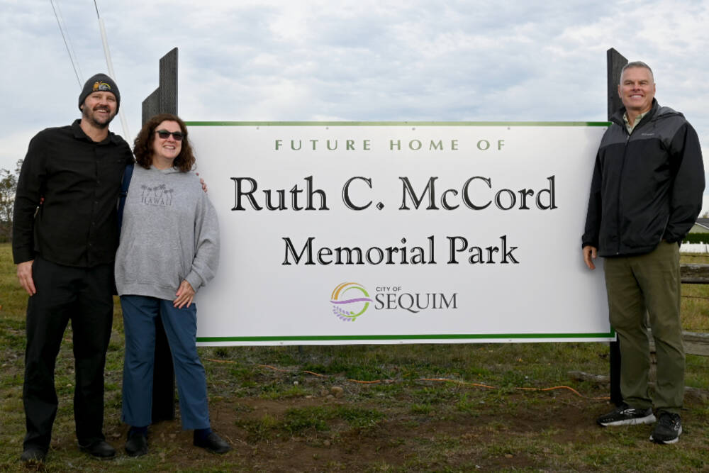 Family members of Ruth McCord celebrate the dedication of a park named after their mother’s legacy on Oct. 25. The future park, located near North Seventh Avenue and West Hendrickson Road, looks to honor the late Sequim resident’s wishes to offer a place for youngsters and the elderly alike. (Michael Dashiell/Olympic Peninsula News Group)