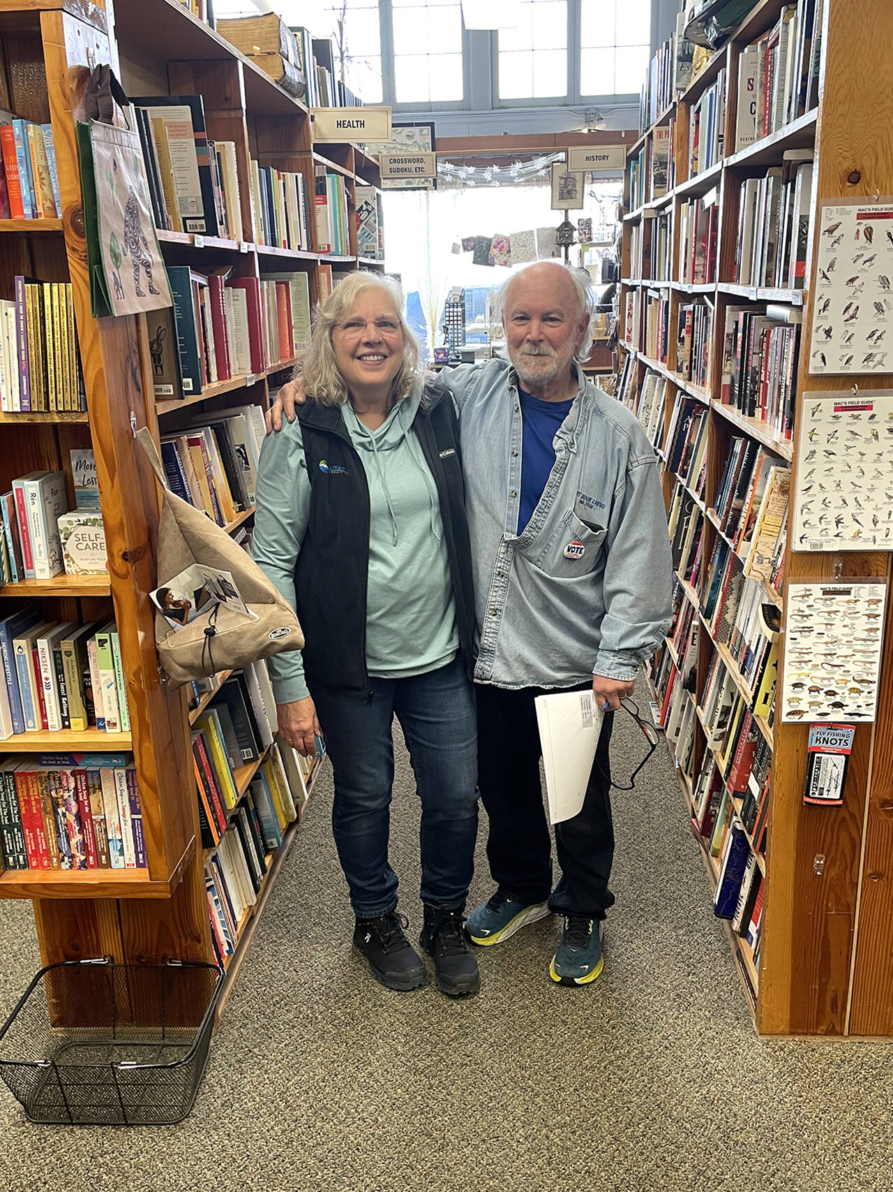 Cindy, left, and Alan Turner are selling Port Book and News after 38 years in business. The store has become a fixture in Port Angeles for its thoughtful selection of books, carefully curated gifts, exceptional customer service and community-minded spirit. (Paula Hunt/Peninsula Daily News)