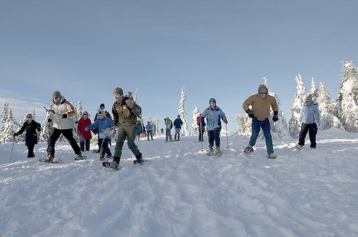 Michael Dashiell/Olympic Peninsula News Group 
Hurricane Ridge visitors take part in a family snowshoe walk in 2019. Winter sports activities on the Ridge are supported by the annual Winterfest banquet, set for Nov. 23 at the Vern Burton Center.