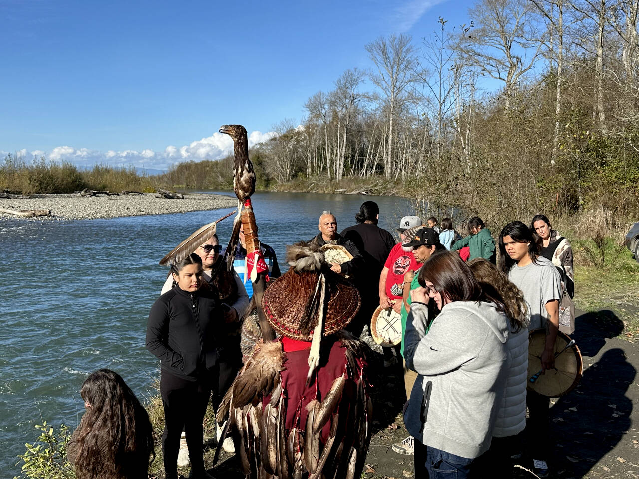 Lower Elwha Klallam Tribe members gather by the Elwha River to hold a ceremony in support of a petition to protect forests in the Elwha River Watershed. (John Gussman)