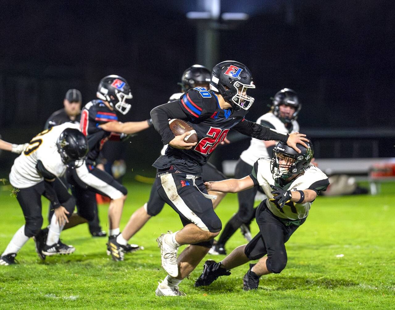 East Jefferson's Luke O'Hara ran for 201 yards and four touchdowns Friday night against Vashon as the Rivals won their season finale 55-0. (Steve Mullensky/for Peninsula Daily News)