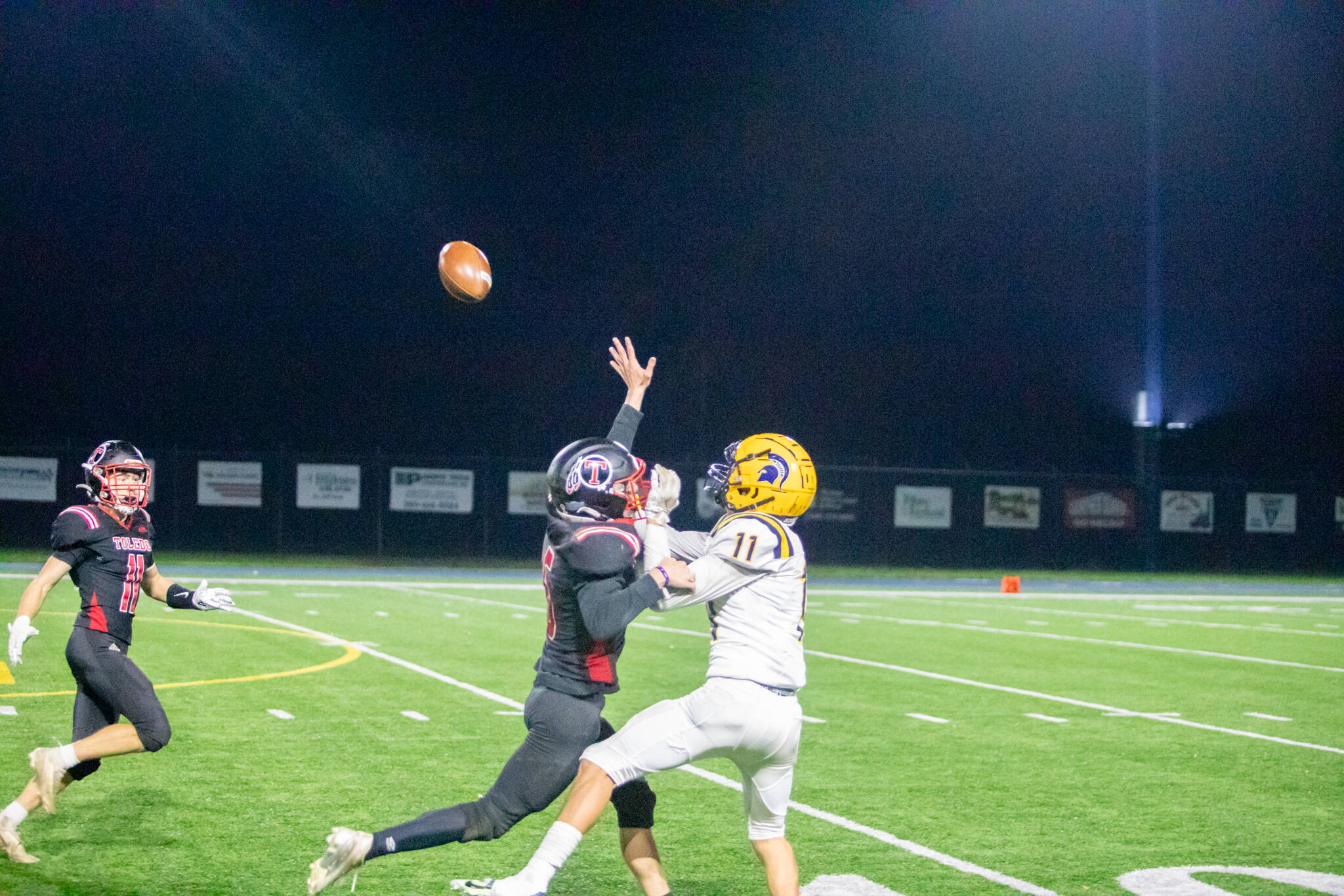 Skyler Smith/Blast Zone Media
Forks' Cash Barajas attempts to haul in a pass despite the early contact of the Toledo defensive back during the Spartans' 63-20 Class 2B District 4 Crossover playoff on Friday at Kelso High School.