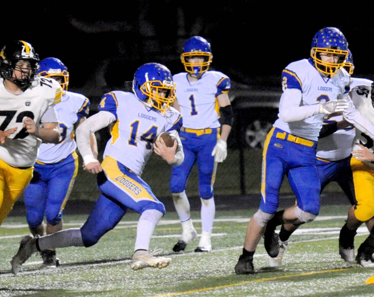 Crescent's Dom Sprague (No. 14) gained 312 yards rushing against North Beach on Friday night in Forks in the Loggers' 48-14 win. (Lonnie Archibald/for Peninsula Daily News)