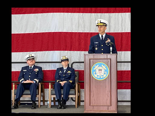 Rear Admiral Charles E. Fosse, right, U.S. Coast Guard District 13 commander, was the guest speaker at the U.S. Coast Guard Station Port Angeles’ annual Veterans Day celebration on Monday. Chaplain Mike VanProyen, left, and Kelly Higgins, the commanding officer at Coast Guard Air Station Port Angeles, also participated in the ceremony. (Paula Hunt/Peninsula Daily News)