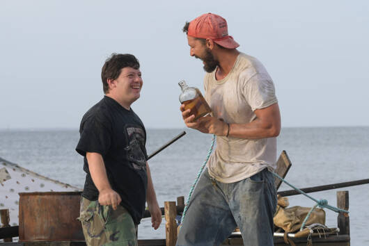 Zak (Zack Gottsagen) and Tyler (Shia Labeouf) near the raft they built together to travel by water. (Port Townsend Film Festival)