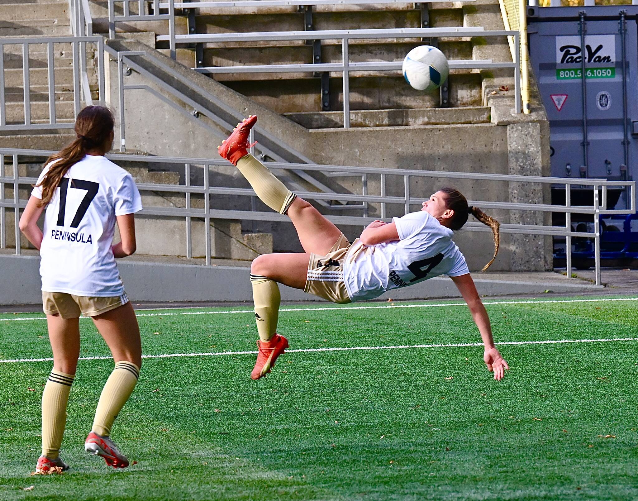 Jay Kline (2)/for Peninsula College Athletics 
Peninsula’s Shawna Larson attempts a bicycle kick during the first half of the Pirates’ NWAC Semifinal win over Spokane as teammate Emma Crystal looks on.