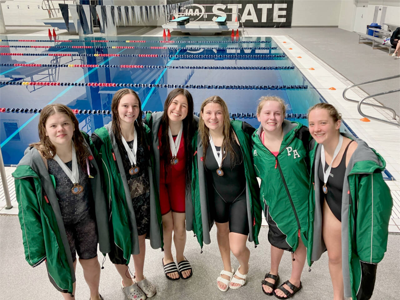 The Port Angeles girls swim team finished eighth at the 2A state swim championships this weekend, the 12th straight year Port Angeles has finished in the top 10. From left are, Amayah Nelson, Lynzee Reid, Danika Asgeirsson, Brooke St. Luise, Emerson DuBois and Lizzy Shaw. (Sally Cole)