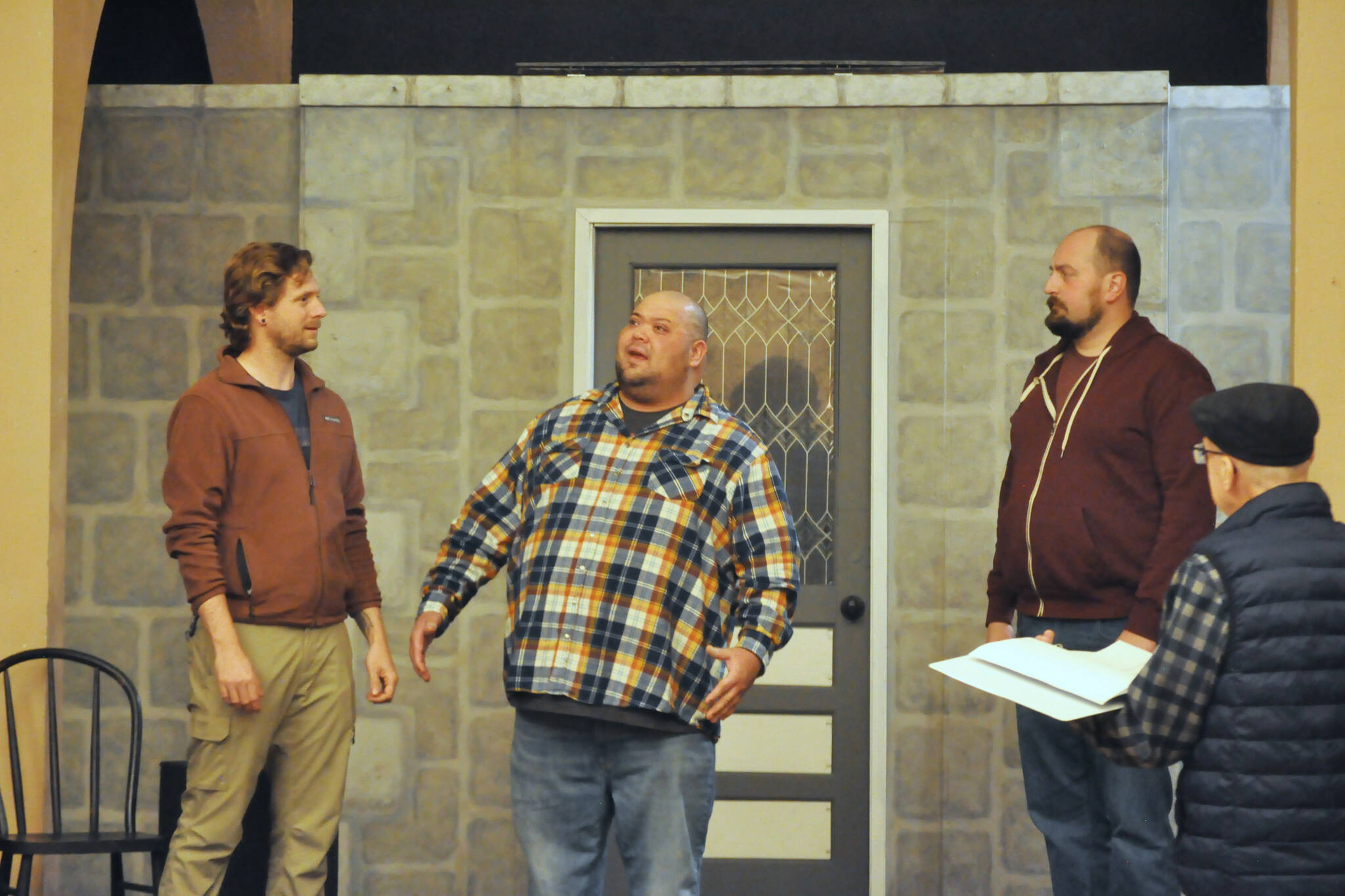 Actors, from left, Justin Stapleton, Mario Arruda and Sean Stone rehearse “Artificial Emotions,” a short play written by John Painter and directed by Bill Stone, far right. It will be the first of eight plays in Olympic Theatre Arts’ New Works Showcase through Sunday. (Matthew Nash/Olympic Peninsula News Group)