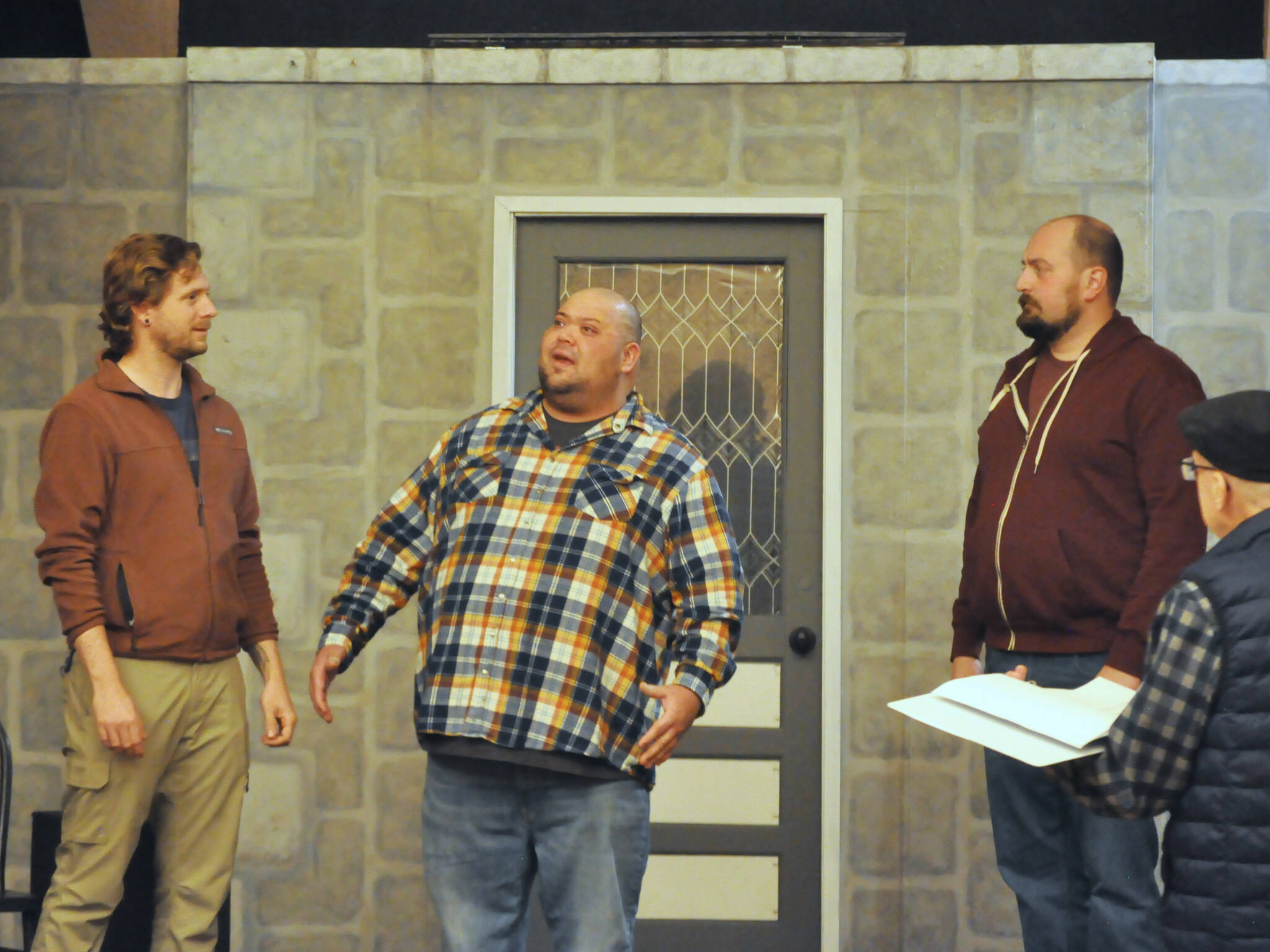 Actors, from left, Justin Stapleton, Mario Arruda and Sean Stone rehearse “Artificial Emotions,” a short play written by John Painter and directed by Bill Stone, far right. It will be the first of eight plays in Olympic Theatre Arts’ New Works Showcase through Sunday. (Matthew Nash/Olympic Peninsula News Group)