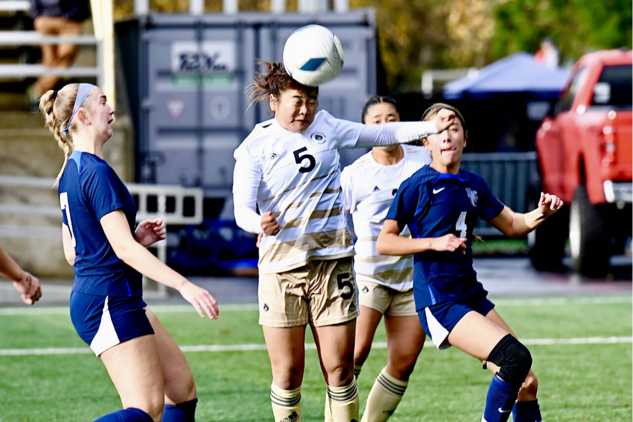 Risa Nishida (5) heads the ball against Bellevue on Sunday at the Starfire Soccer Complex in Tukwila. The Pirates beat Bellevue for their sixth NWAC championship. (Jay Cline/Peninsula College)