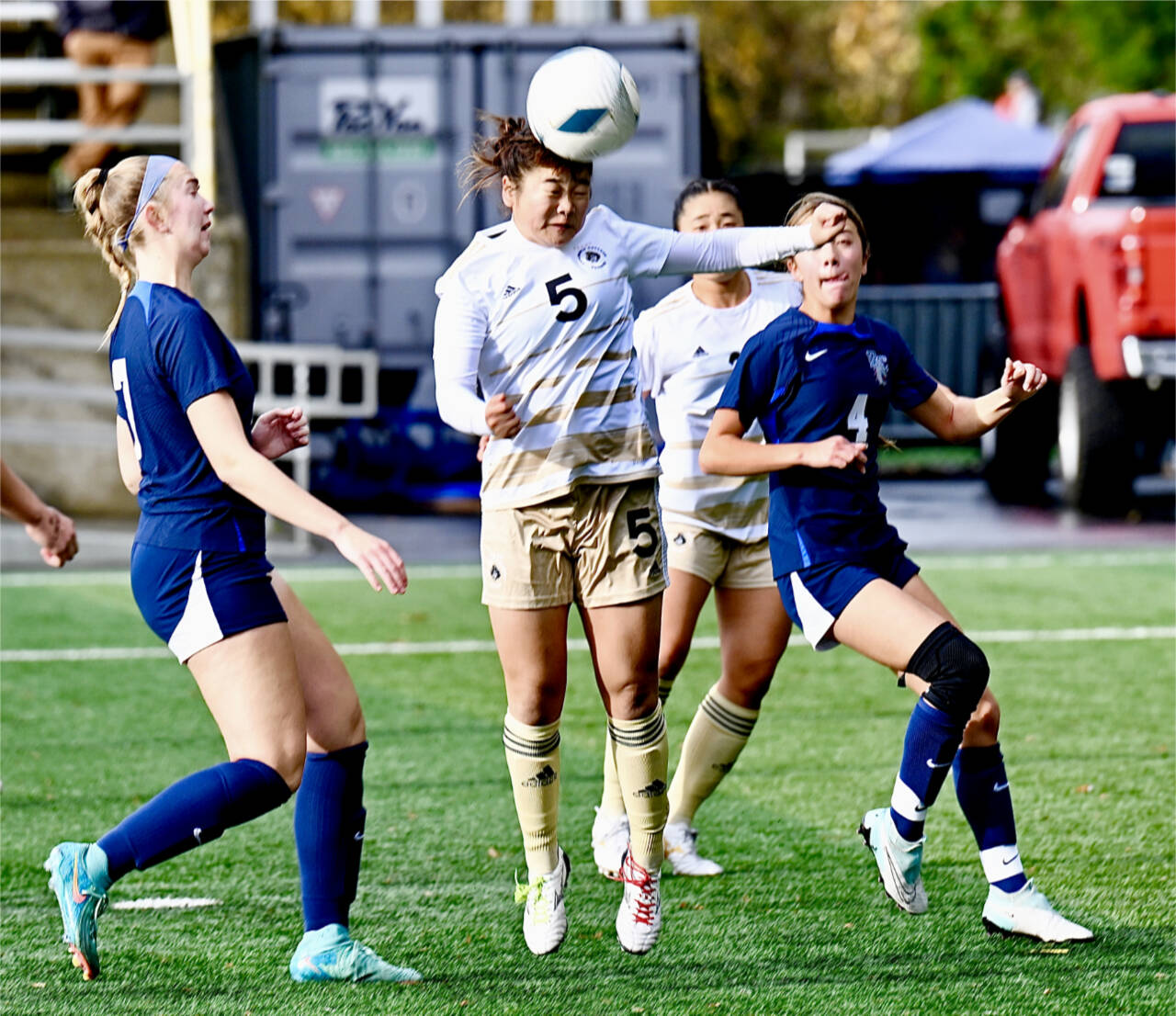 Risa Nishida (5) heads the ball against Bellevue on Sunday at the Starfire Soccer Complex in Tukwila. The Pirates beat Bellevue for their sixth NWAC championship. (Jay Cline/Peninsula College)