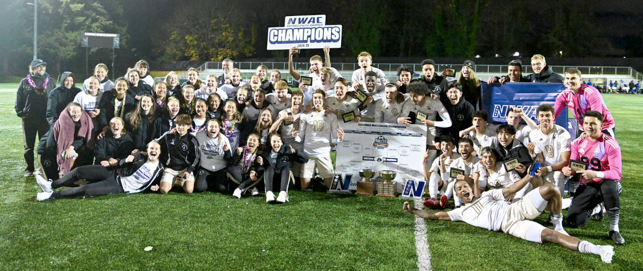 The Peninsula College men's and women's soccer teams celebrate their dual championships Sunday night Tukwila after the men beat Clark College 3-0 in their finals match. (Peninsula College)