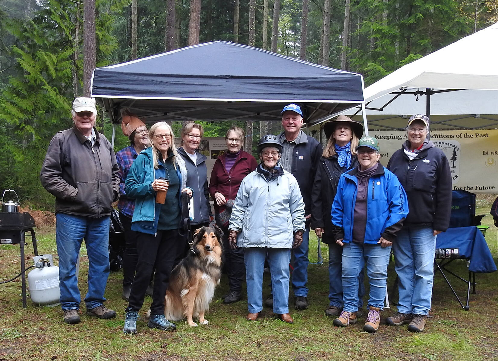 Country Horsemen Peninsula Chapter members honored former Clallam County Commissioner Martha Ireland for her work attaining the county’s acquisition of the Robin Hill property, and a new equestrian trail built, with a ride through the park on Nov. 9. From left, Tom Mix, Kim Merrick, Suzanne King, Ben Wildman, Juelie Dalzell, Martha Ireland, Dan Dosey, Teresa Crossley, Linda Morin and Denise Hupfer. (PHOTO BY BEN WILDMAN)