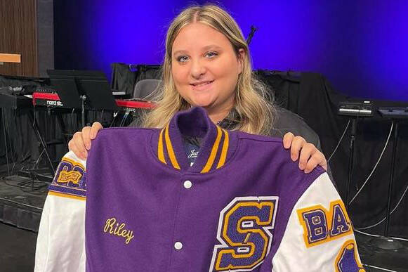 Photo courtesy Sarah Campbell/ Sequim High School junior Riley Campbell received a Letterman jacket on Nov. 9 for her years of service volunteering with the Wolf Pack youth football and cheer program. She started in the organization in kindergarten.