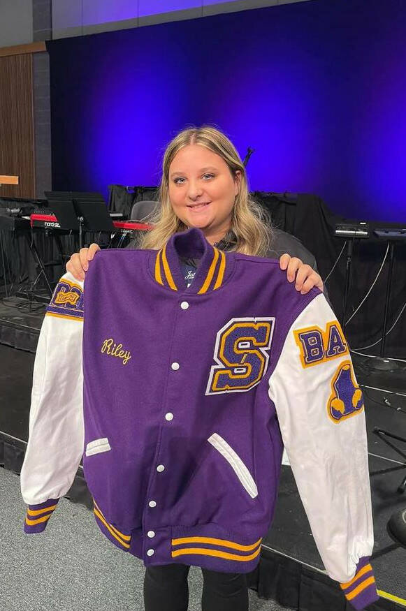 Sequim High School junior Riley Campbell received a Letterman jacket on Nov. 9 for her years of service, volunteering with the Sequim Wolf Pack youth football and cheer program. (Sarah Campbell)