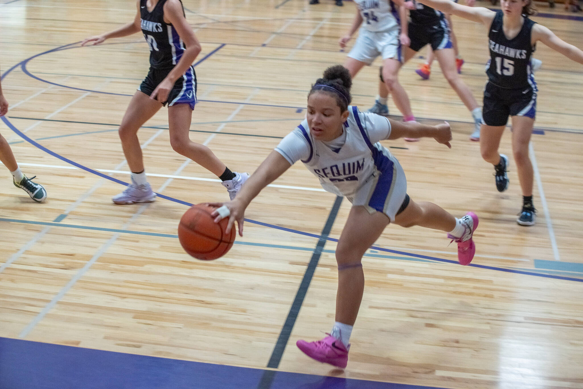 Emily Matthiessen/Olympic Peninsula News Group 
Sequim’s Bobbi Mixon attempts to save the ball from going out of bounds during the Wolves’ season-opening 50-30 loss to Anacortes on Wednesday.