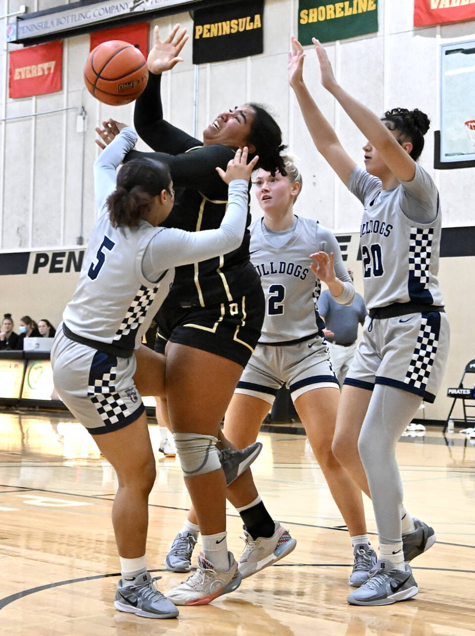 Peninsula College’s Jelissa Julmist is surrounded by three Bellevue defenders Saturday in Port Angeles. (Jay Cline/Peninsula College)