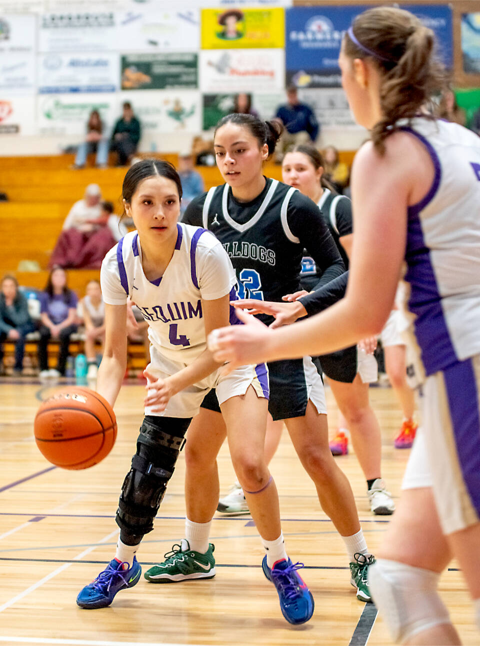 (Emily Matthiessen/Olympic Peninsula News Group) Sequim's Gracie Chartraw (No. 4) looks to pass against North Mason on Tuesday in Sequim. She is still recovering from an injury last season, but is expected to be one of the Wolves’ leading scorers, said coach Joclin Julmist.