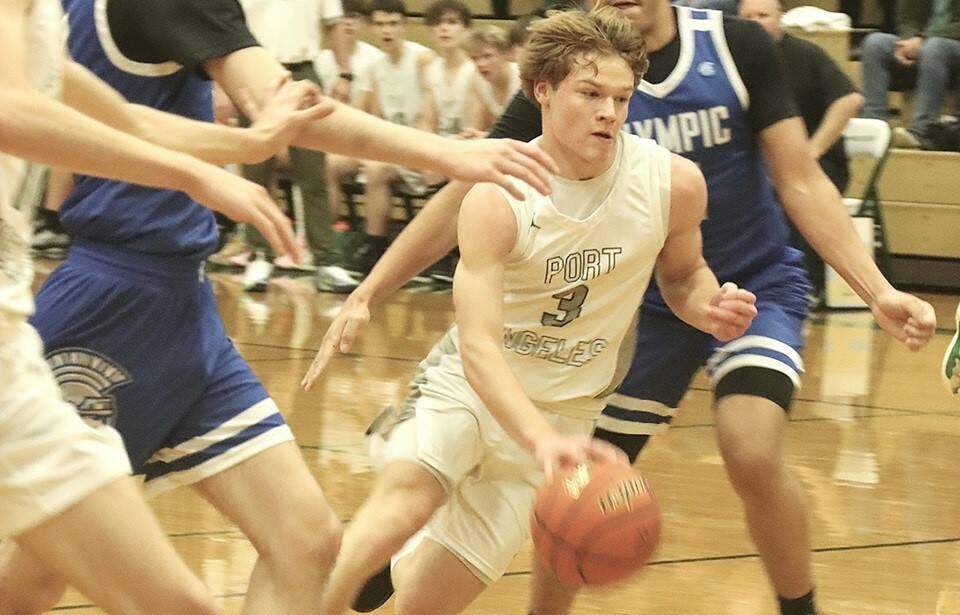 Port Angeles' Gus Halberg drives the lane against Olympic on Friday night. Halberg had 25 points and went to the free-throw line 17 times in a 75-40 Port Angeles victory. (Dave Logan/for Peninsula Daily News)