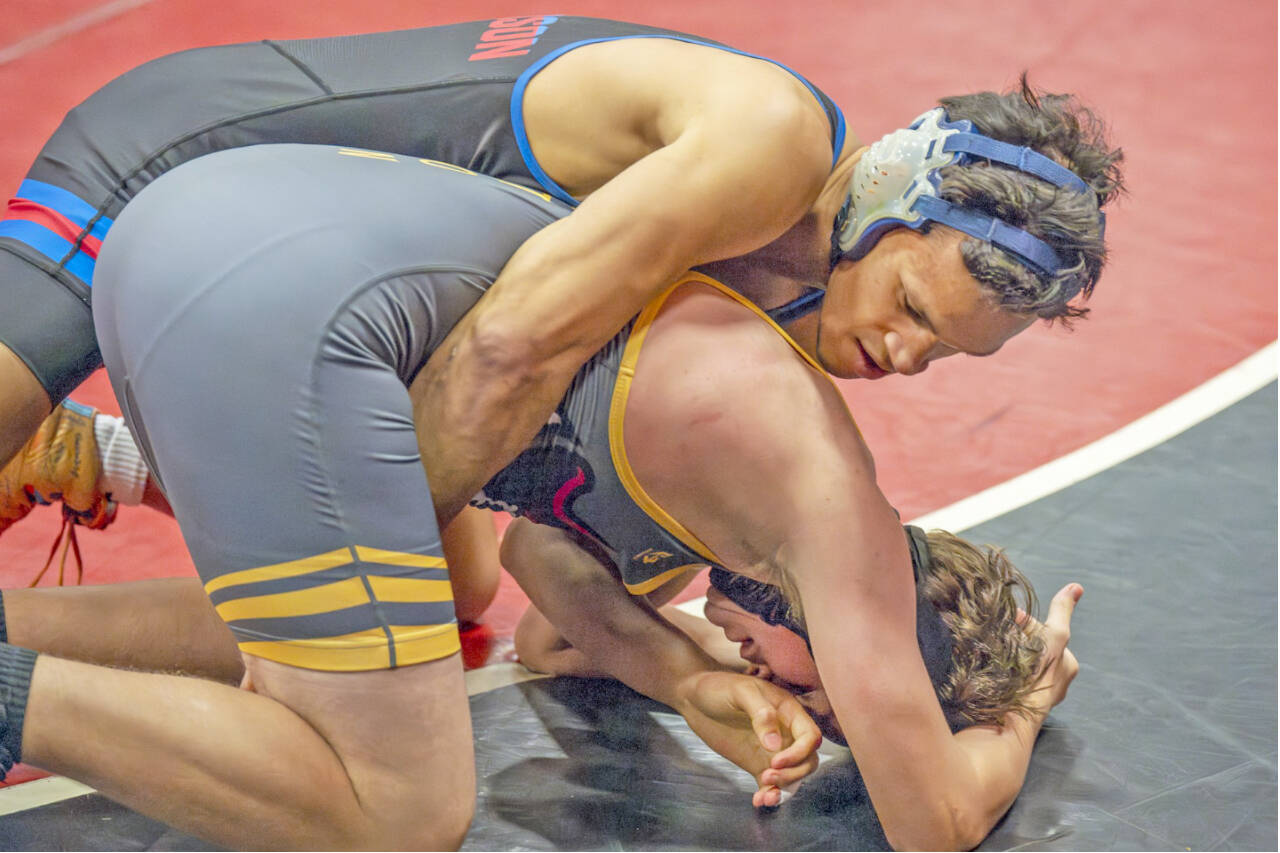 East Jefferson’s Manaseh Lanphear Ramirez gets a pin against Charles Damien of Kingston at 150 pounds during the Rivals’ duals tournament held this weekend in Port Townsend. (Steve Mullensky/for Peninsula Daily News)