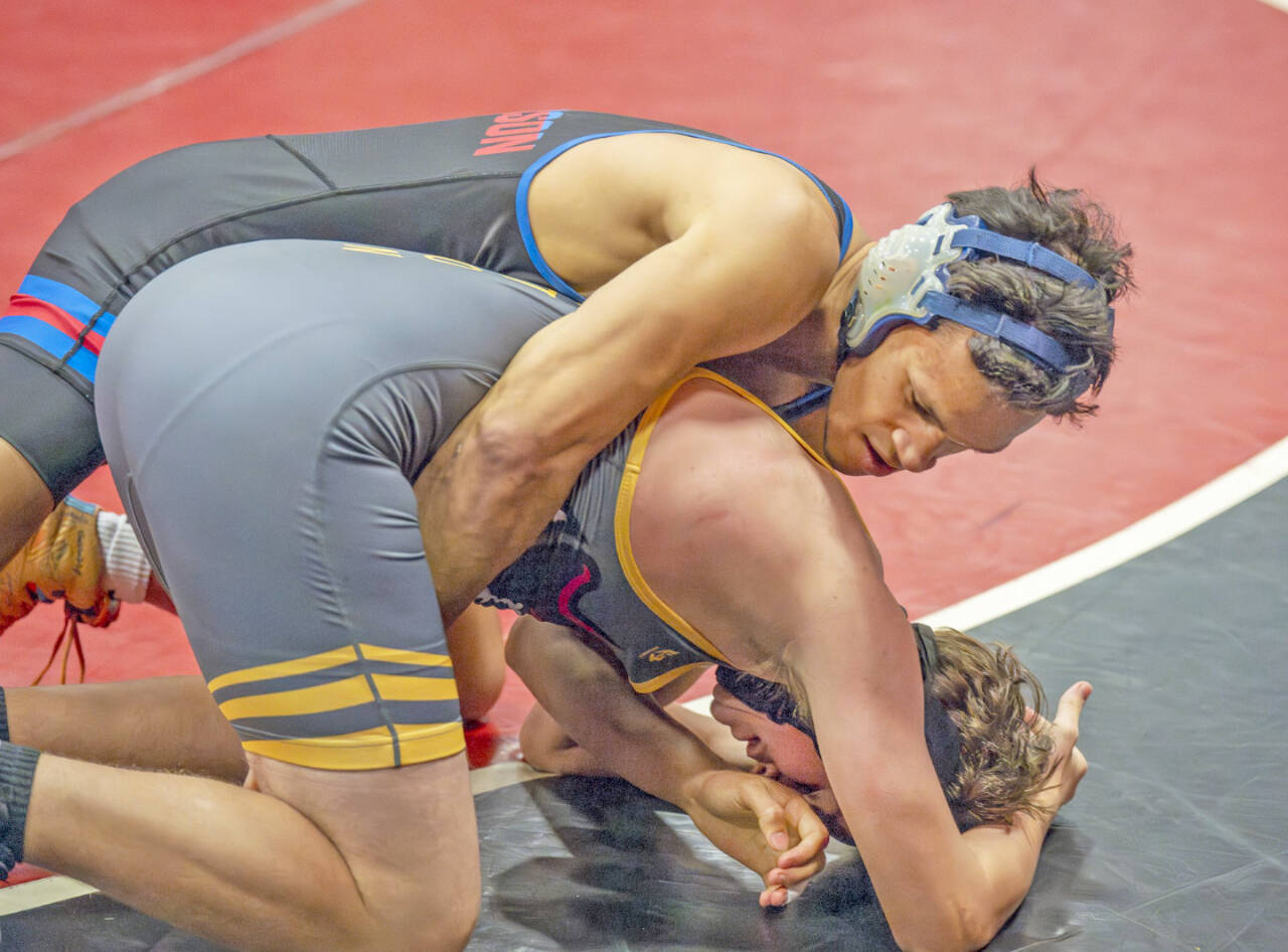 East Jefferson’s Manaseh Lanphear Ramirez gets a pin against Charles Damien of Kingston at 150 pounds during the Rivals’ duals tournament held this weekend in Port Townsend. (Steve Mullensky/for Peninsula Daily News)