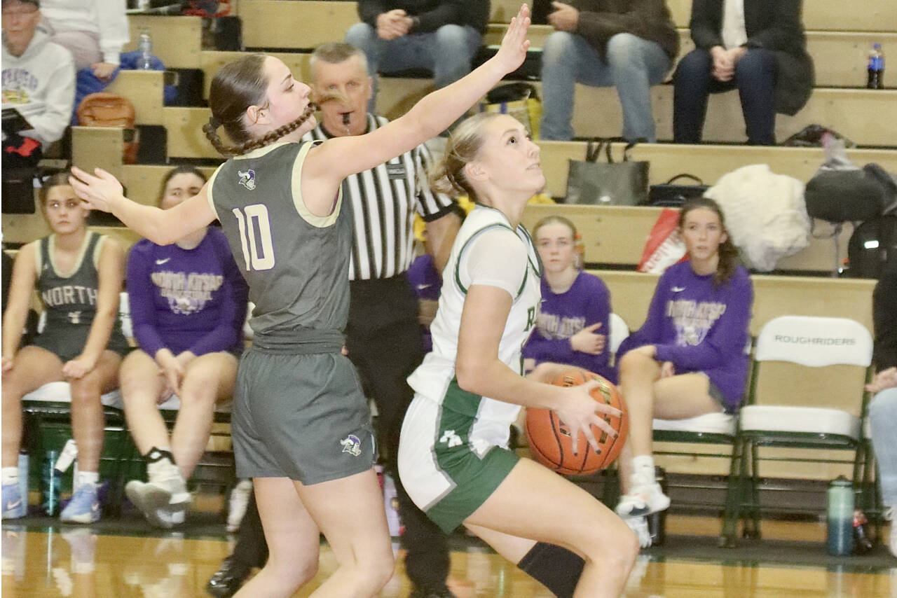 Port Angeles’ Teanna Clark goes up for a basket against North Kitsap in Port Angeles on Tuesday. Clark had a solid game with 14 points, five assists and four steals in a 53-28 Roughriders victory. (Dave Logan/for Peninsula Daily News)